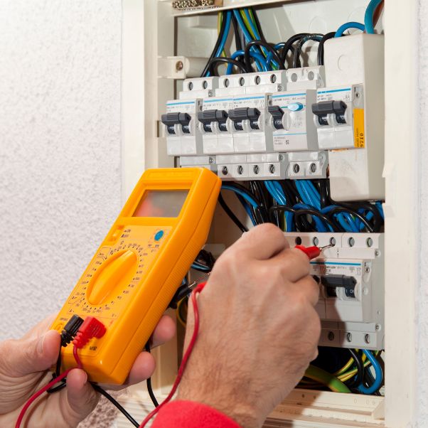 electrician doing some checks on a light box denver nc