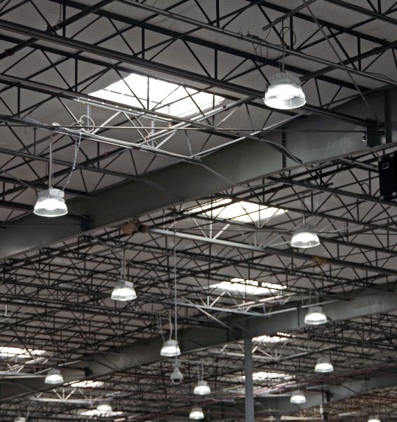 section of a large warehouse ceiling with electrical lighting 2 denver nc