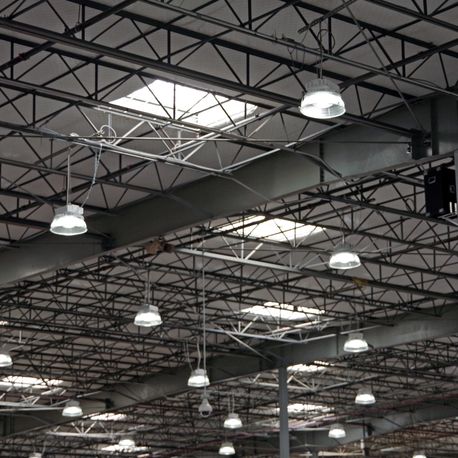 section of a large warehouse ceiling with electrical lighting denver nc